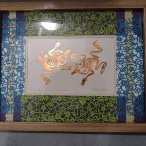 Framed and beautifully matted embossed copper artwork frogs by Bill Reid